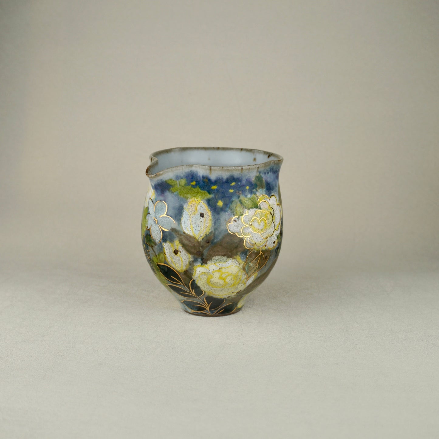 White And Yellow Tea Pitcher